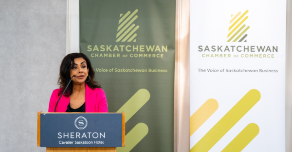 Saskatchewan Chamber of Commerce CEO, Prabha Ramaswamy, speaking at a podium about the Chamber's Provincial Election Platform.